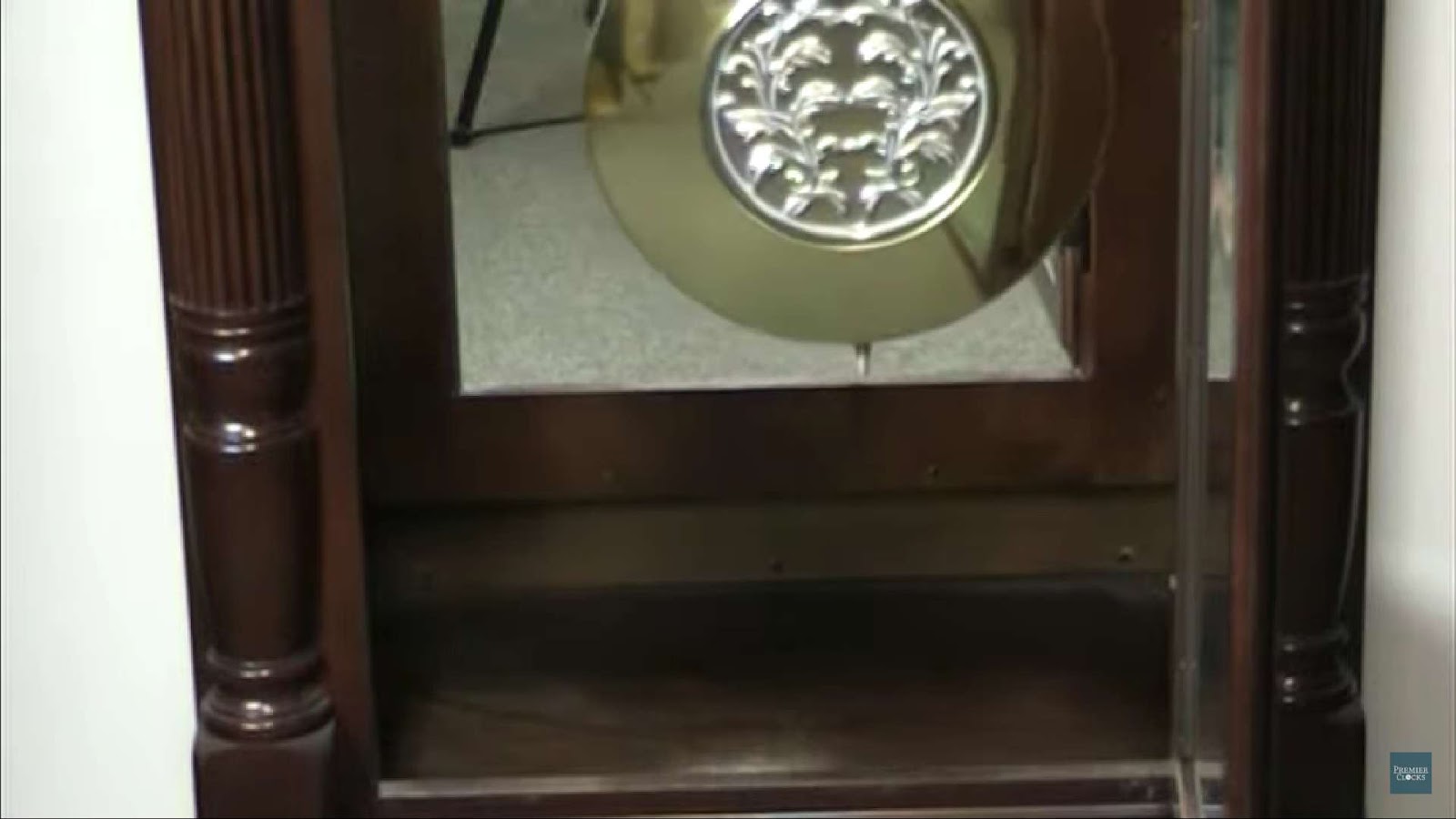 Close up of pendulum hanger of grandfather clock