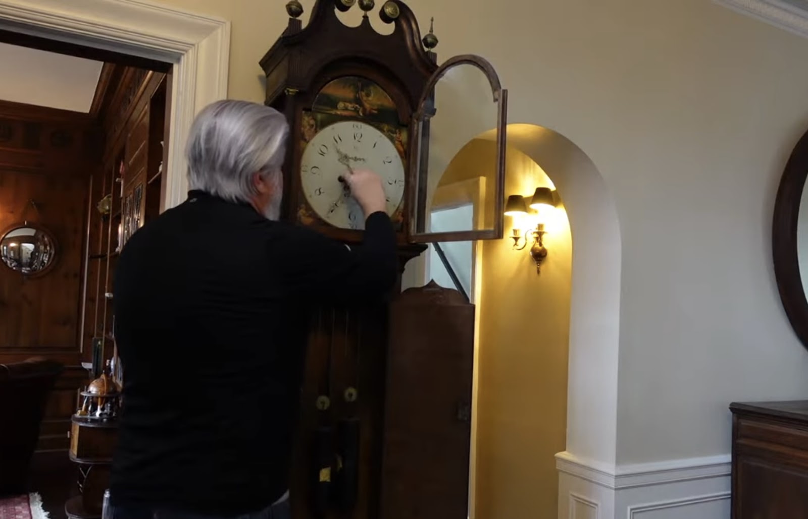 Man is moving a Grandfather Clock