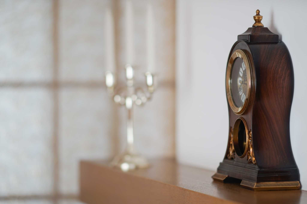 Wooden antique clock next to the wall